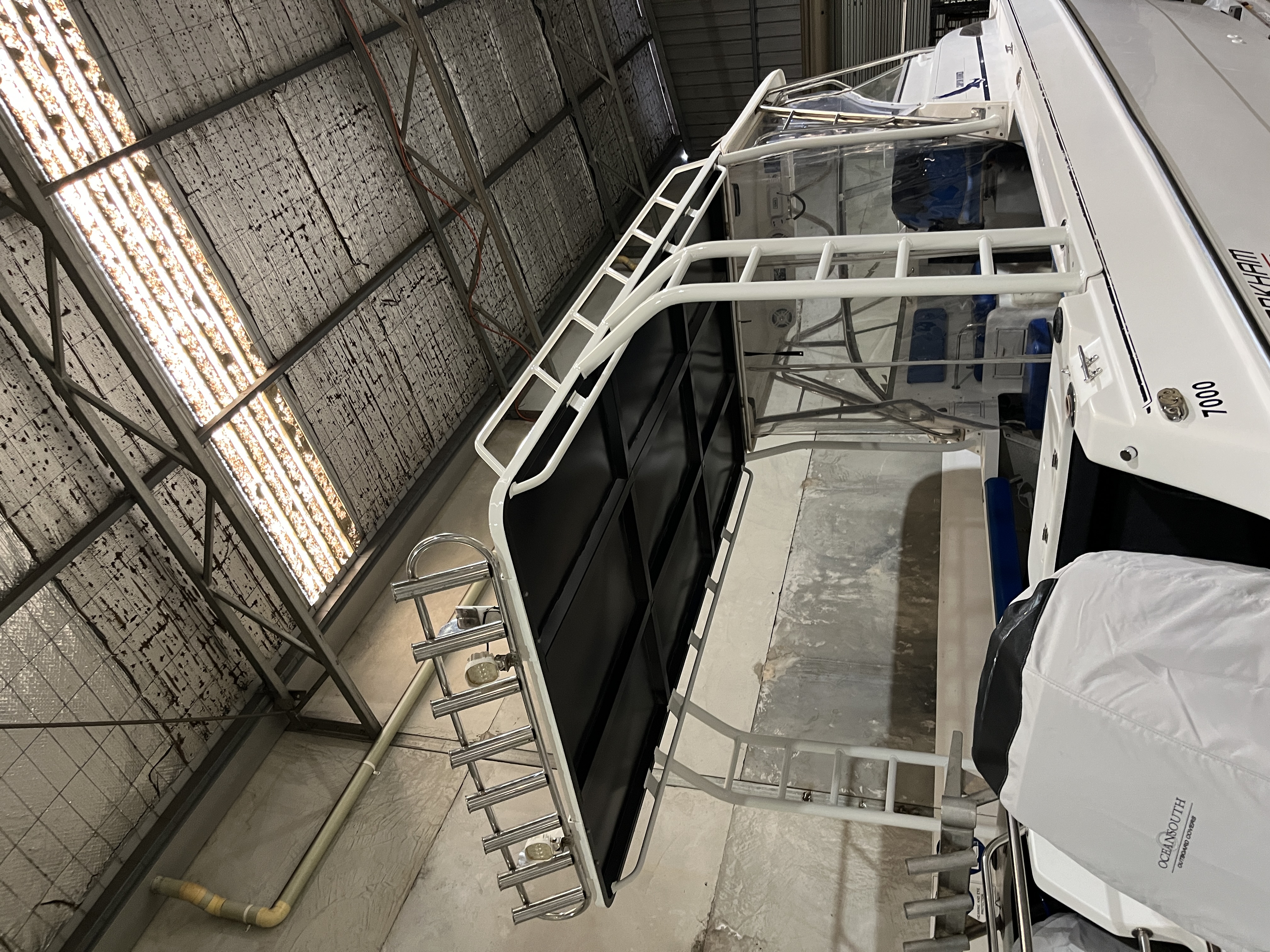 White aluminium boat canopy frame and rod holders