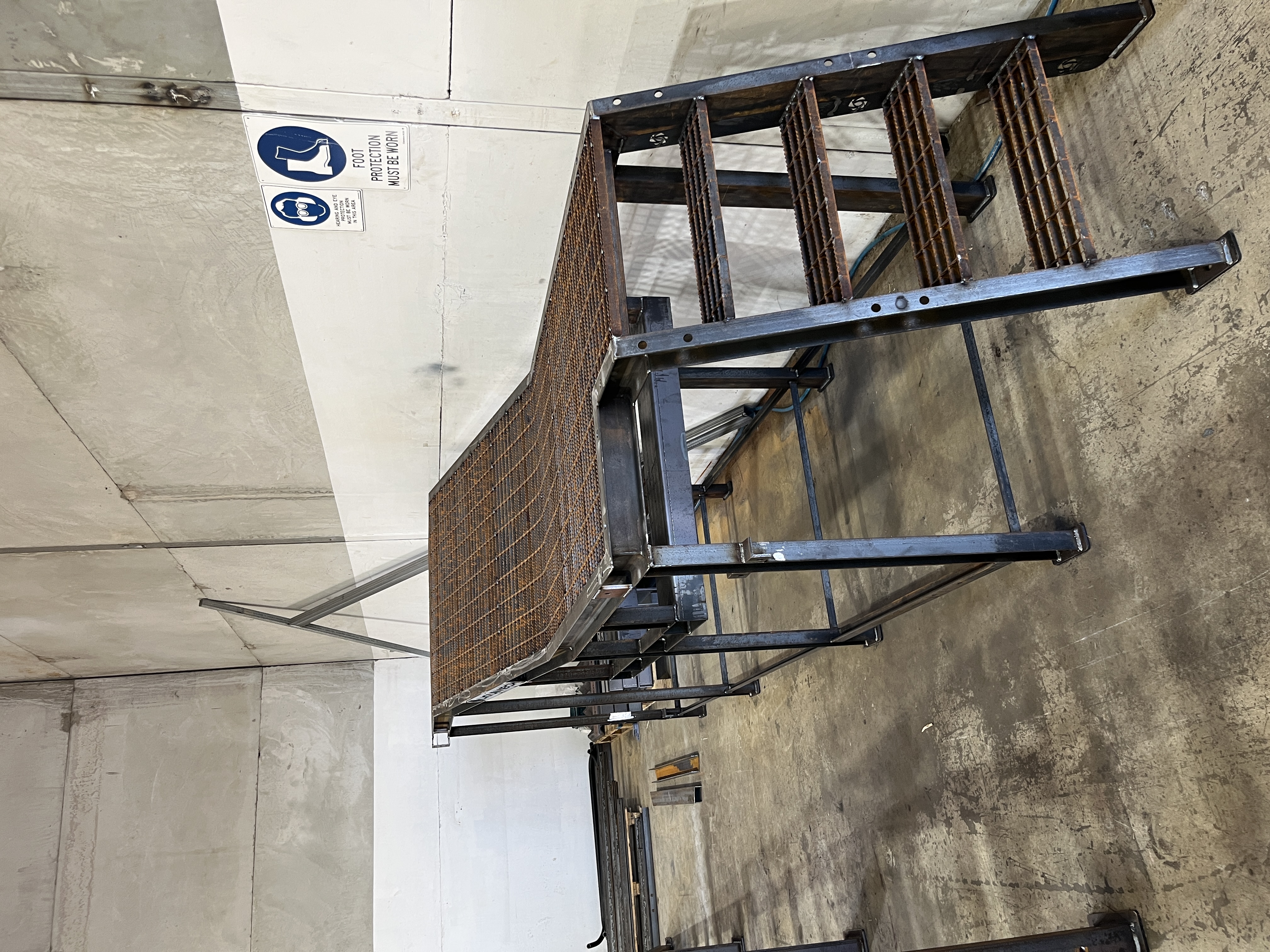 Steel platform and stair fabrication in workshop